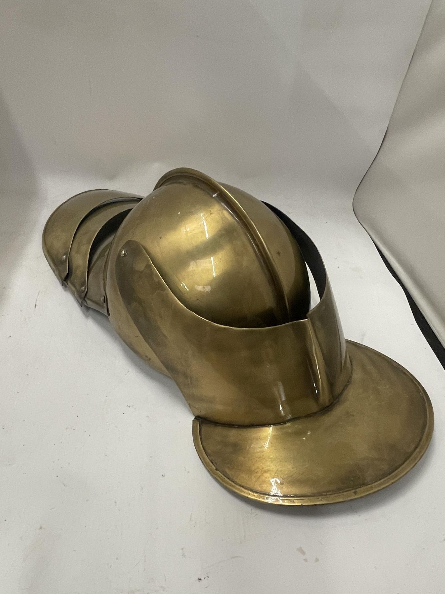 A VINTAGE BRASS EFFECT KNIGHTS HELMET