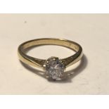 A 9 CARAT GOLD RING WITH A SOLITAIRE CUBIC ZIRCONIA SIZE J/K