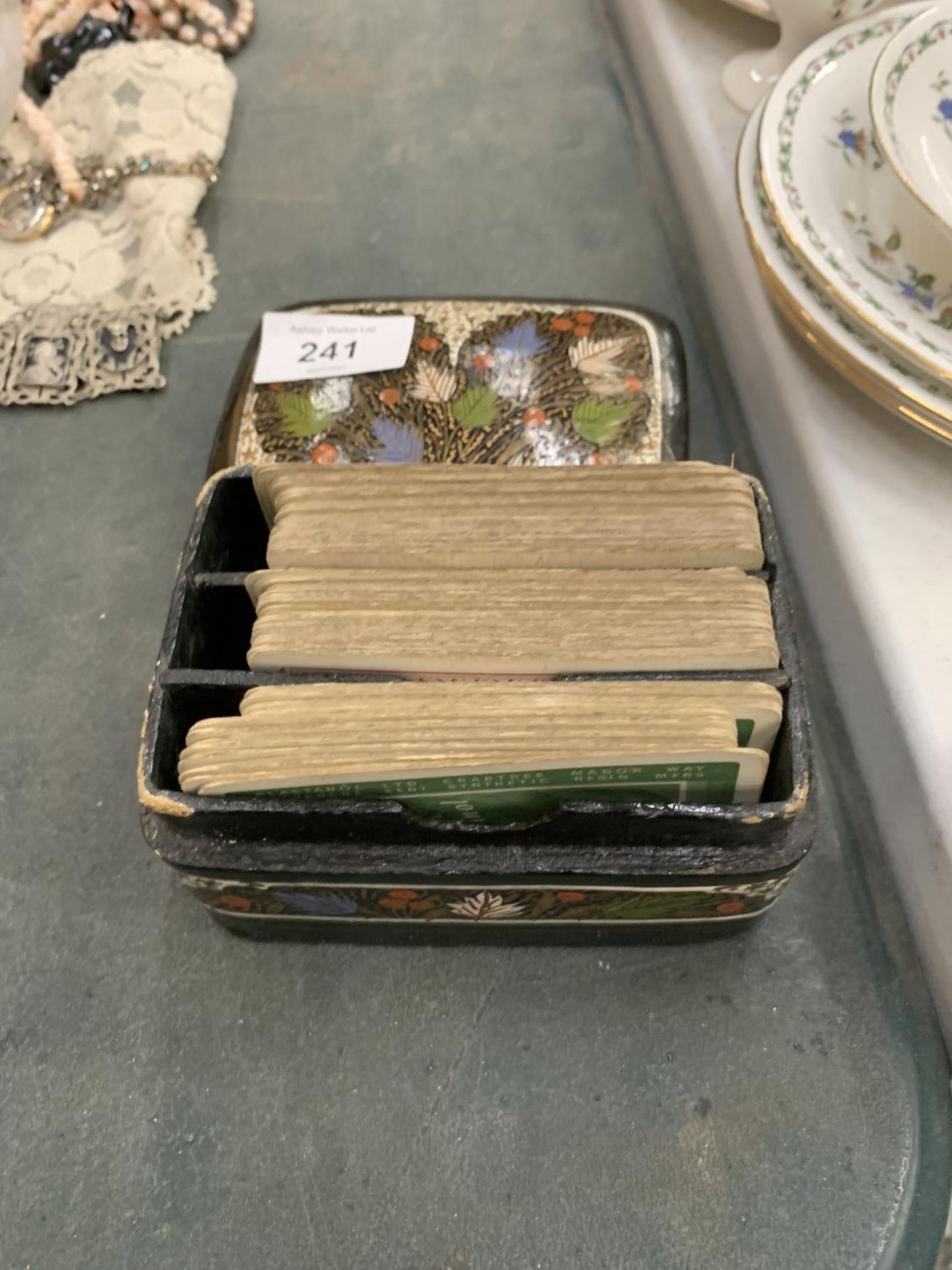 A HANDPAINTED BOX CONTAINING THREE SETS OF VINTAGE CARDS
