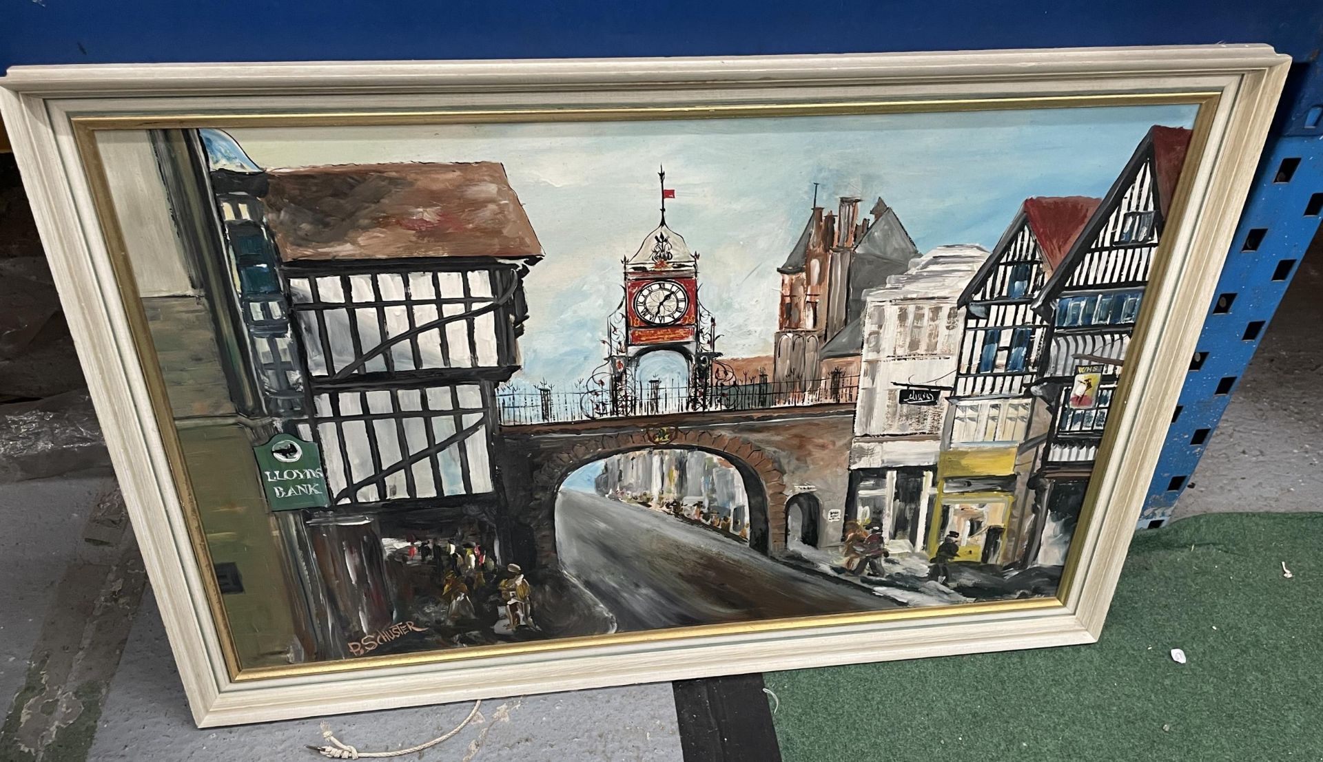 A FRAMED OIL PAINTING OF A HIGH STREET SCENE, SIGNED P.SCHUSTER