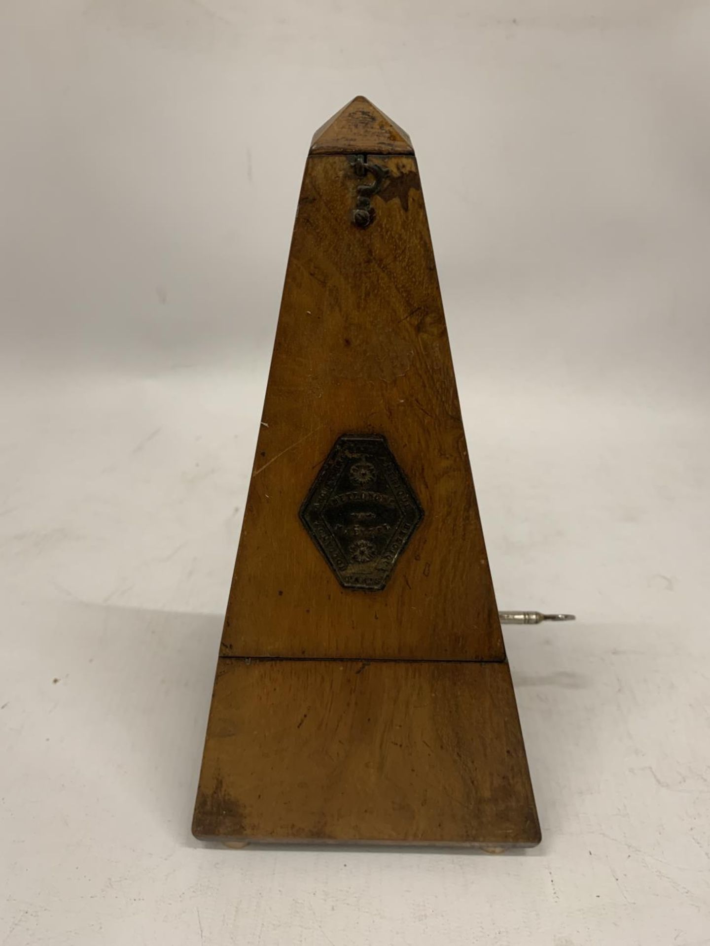 A MAHOGANY CASED METRONOME