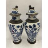 A PAIR OF LATE 19TH CENTURY CHINESE CRACKLE GLAZE BLUE AND WHITE LIDDED TEMPLE VASES, SEAL MARKS