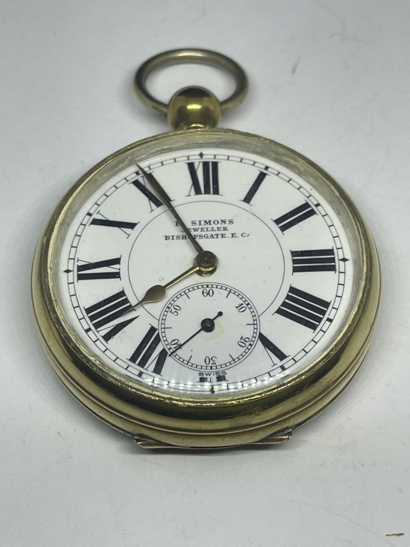 A SIMONS JEWELLERS BISHOPGATE GENTS POCKET WATCH WITH WHITE FACE, ROMAN NUMERALS AND SUB DIAL