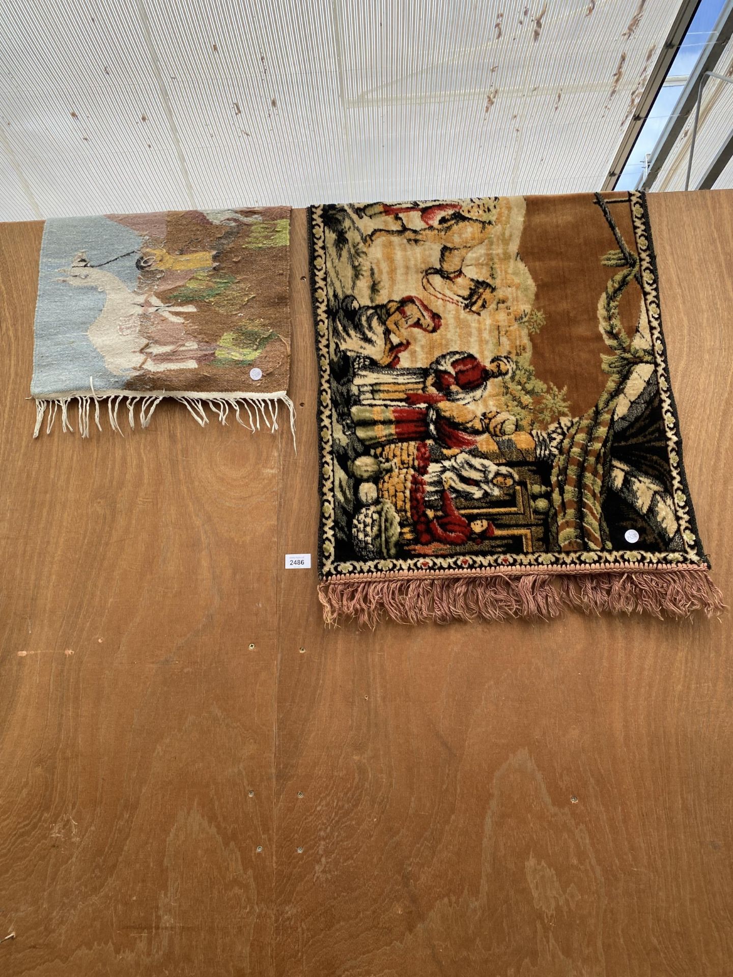 TWO SMALL PATTERNED FRINGED RUGS