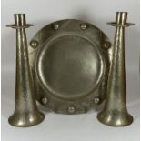 A SET OF THREE VINTAGE ARTS AND CRAFTS HAMMERED PEWTER ITEMS - PAIR OF CANDLESTICKS AND CHARGER,