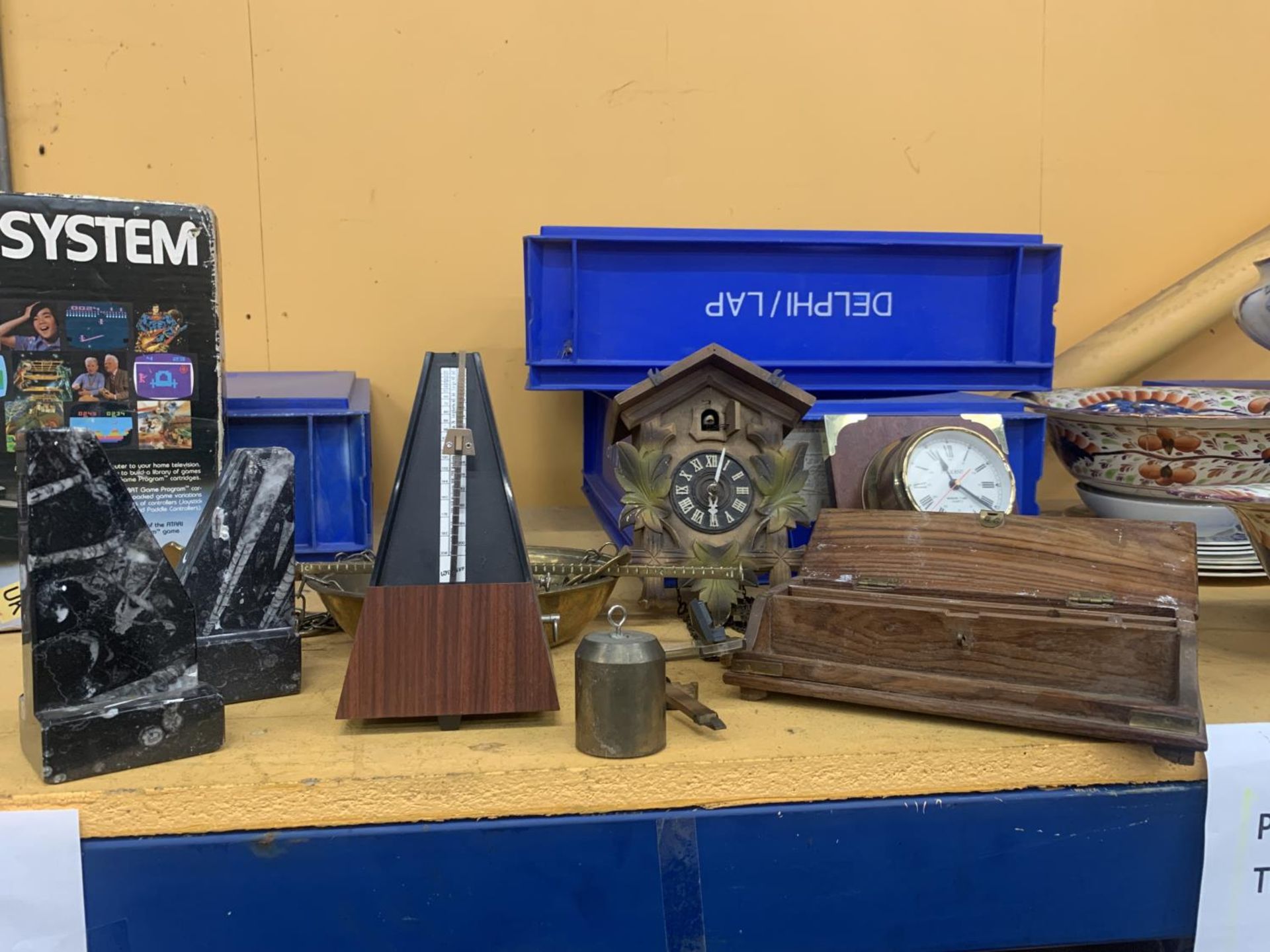 A MIXED LOT TO INCLUDE A CUCKOO CLOCK, METRONOME, BOOK-ENDS, PEN TRAY, HEAVY BRASS SCALES, ETC