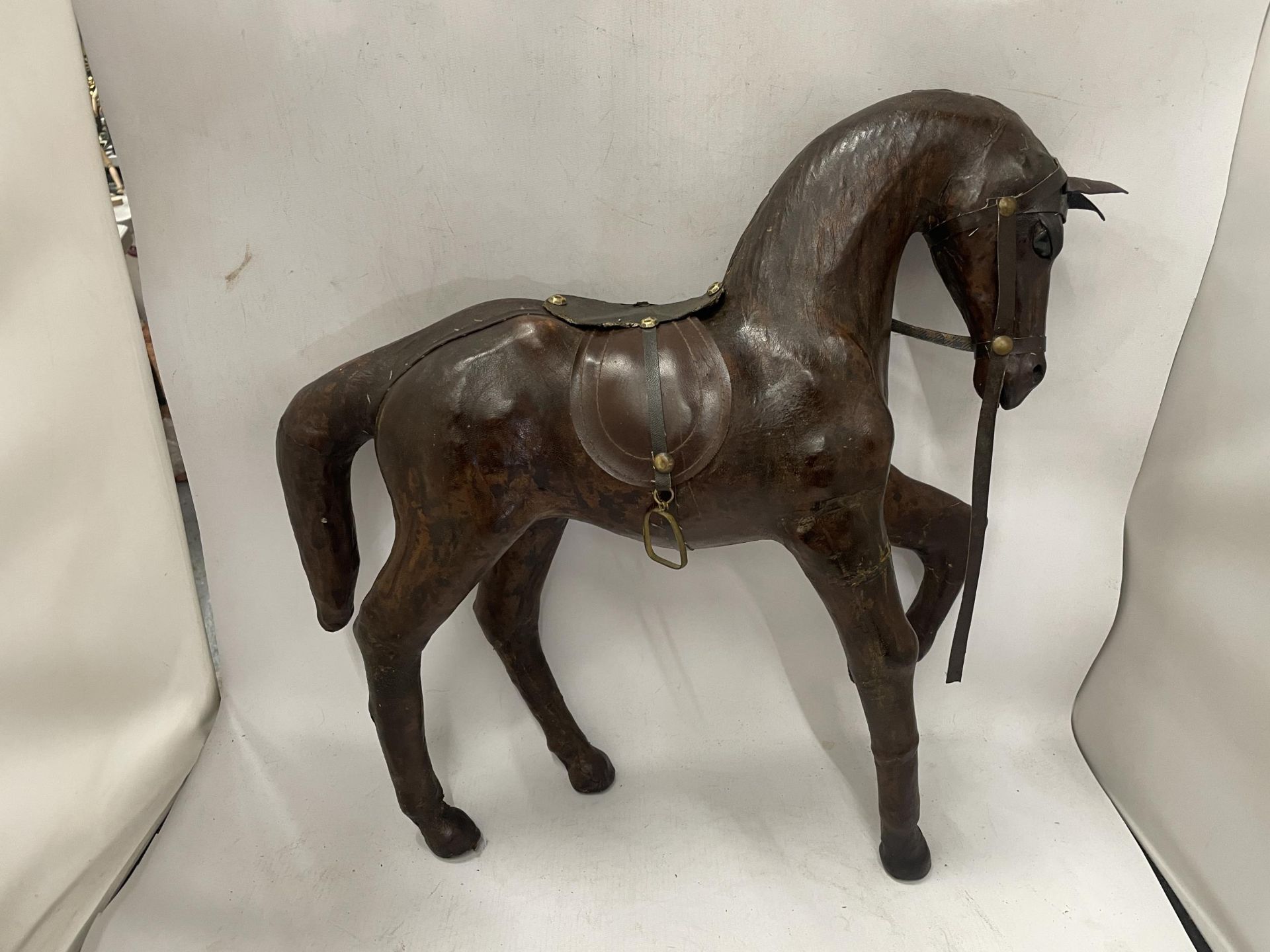 A LARGE VINTAGE LEATHER MODEL OF A HORSE