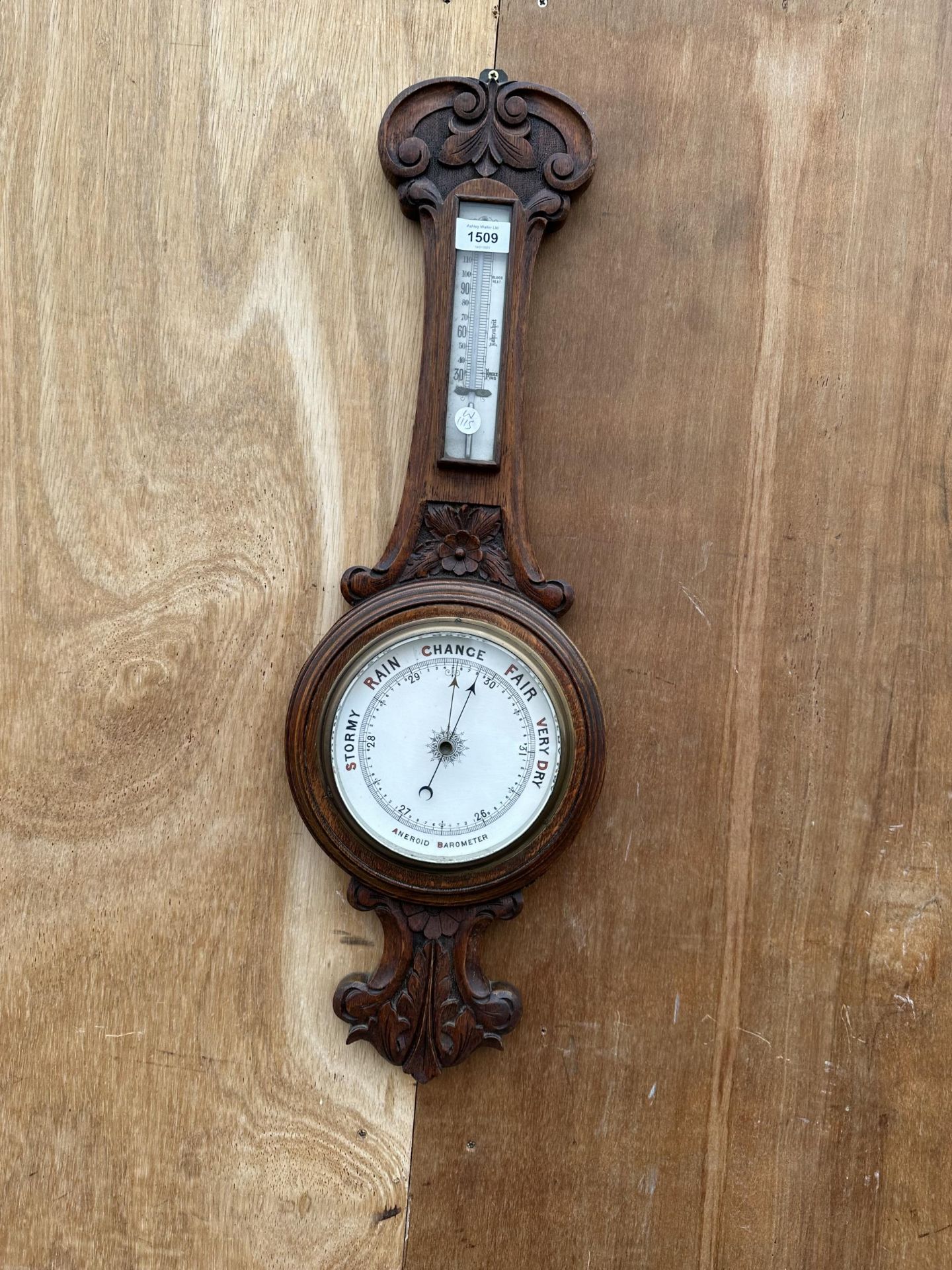 A VINTAGE OAK CASED ANEROID BAROMETER