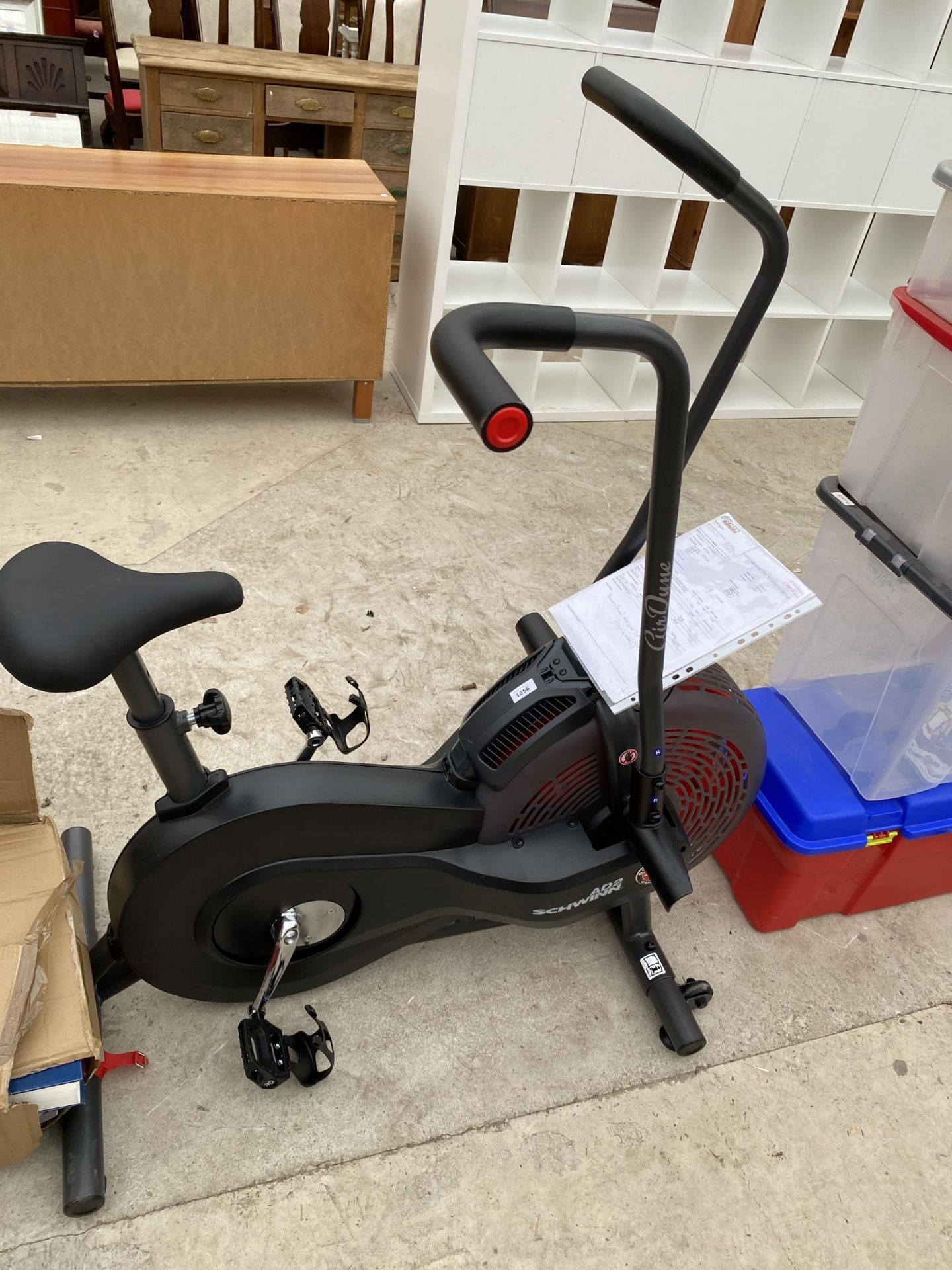 A SCHWINN AIR CYCLE EXERCISE BIKE WITH MANUAL