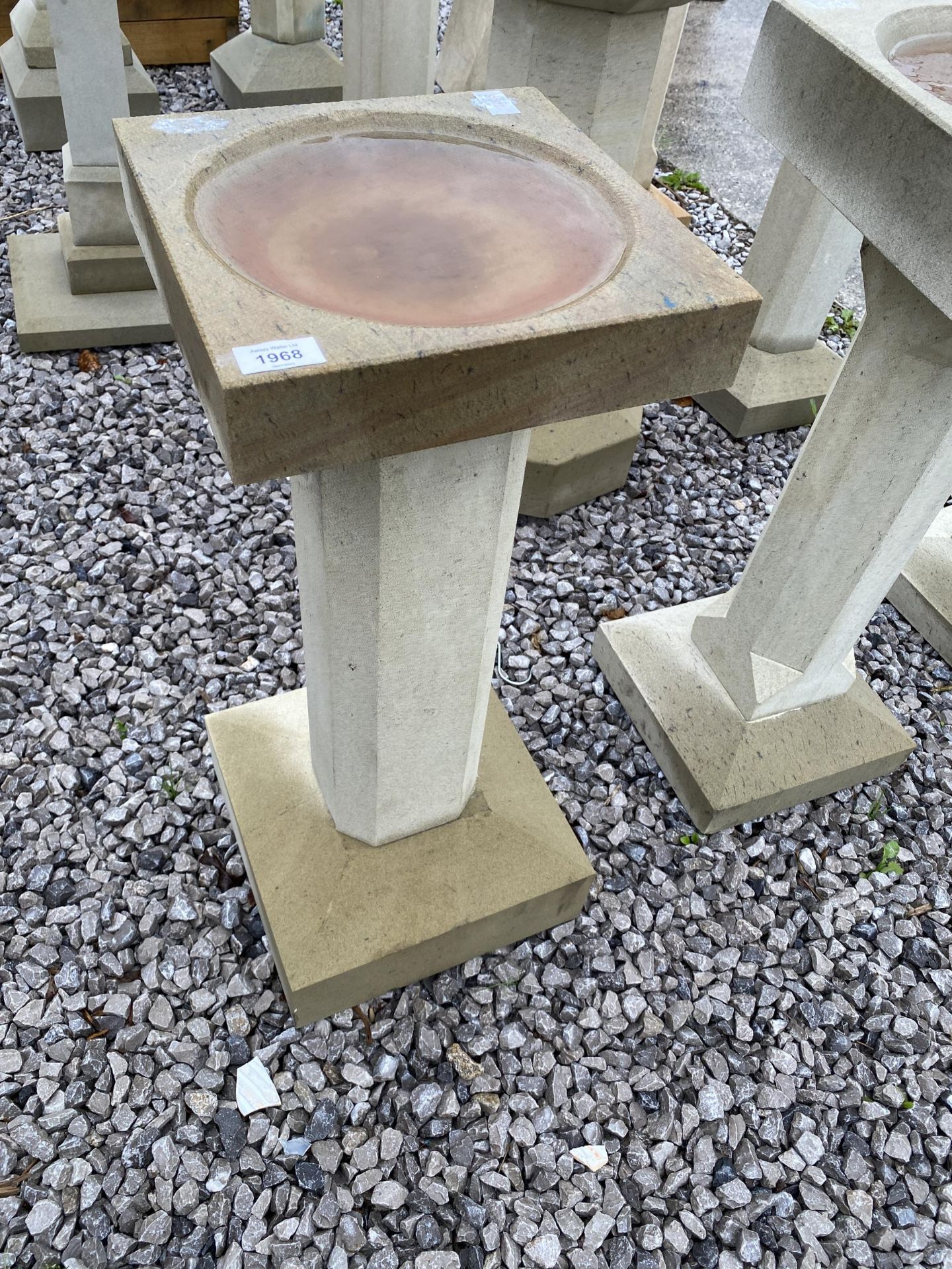 A DECORATIVE YORK STONE BIRD BATH WITH PEDESTAL BASE