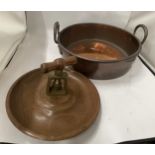 A VINTAGE TWIN HANDLED COPPER BOWL WITH TREEN NUTCRACKER BOWL