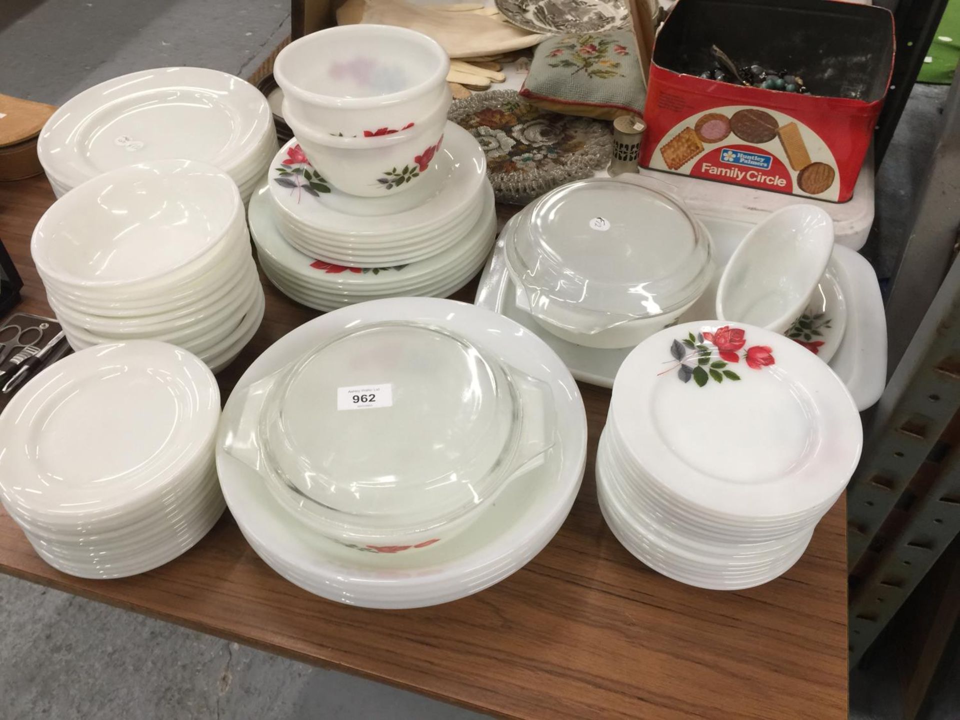 A LARGE QUANTITY OF PYREX STYLE DINNERWARE WITH ROSE PATTERN TO INCLUDE VARIOUS SIZES OF PLATES,
