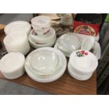 A LARGE QUANTITY OF PYREX STYLE DINNERWARE WITH ROSE PATTERN TO INCLUDE VARIOUS SIZES OF PLATES,