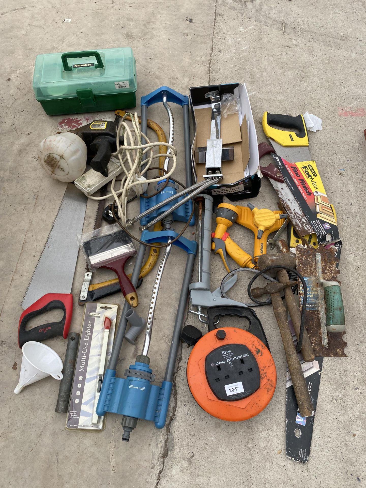 AN ASSORTMENT OF TOOLS TO INCLUDE SPRINKLERS, SAWS AND HAMMERS ETC