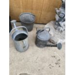 A GALVANISED BUCKET AND TWO GALVANISED WATERING CANS TO INCLUDE A BELDRAY WATERING CAN