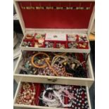 A LARGE QUANTITY OF COSTUME JEWELLERY TO INCLUDE PEARLS, NECKLACES, BEADS, EARRINGS, BANGLES, ETC IN