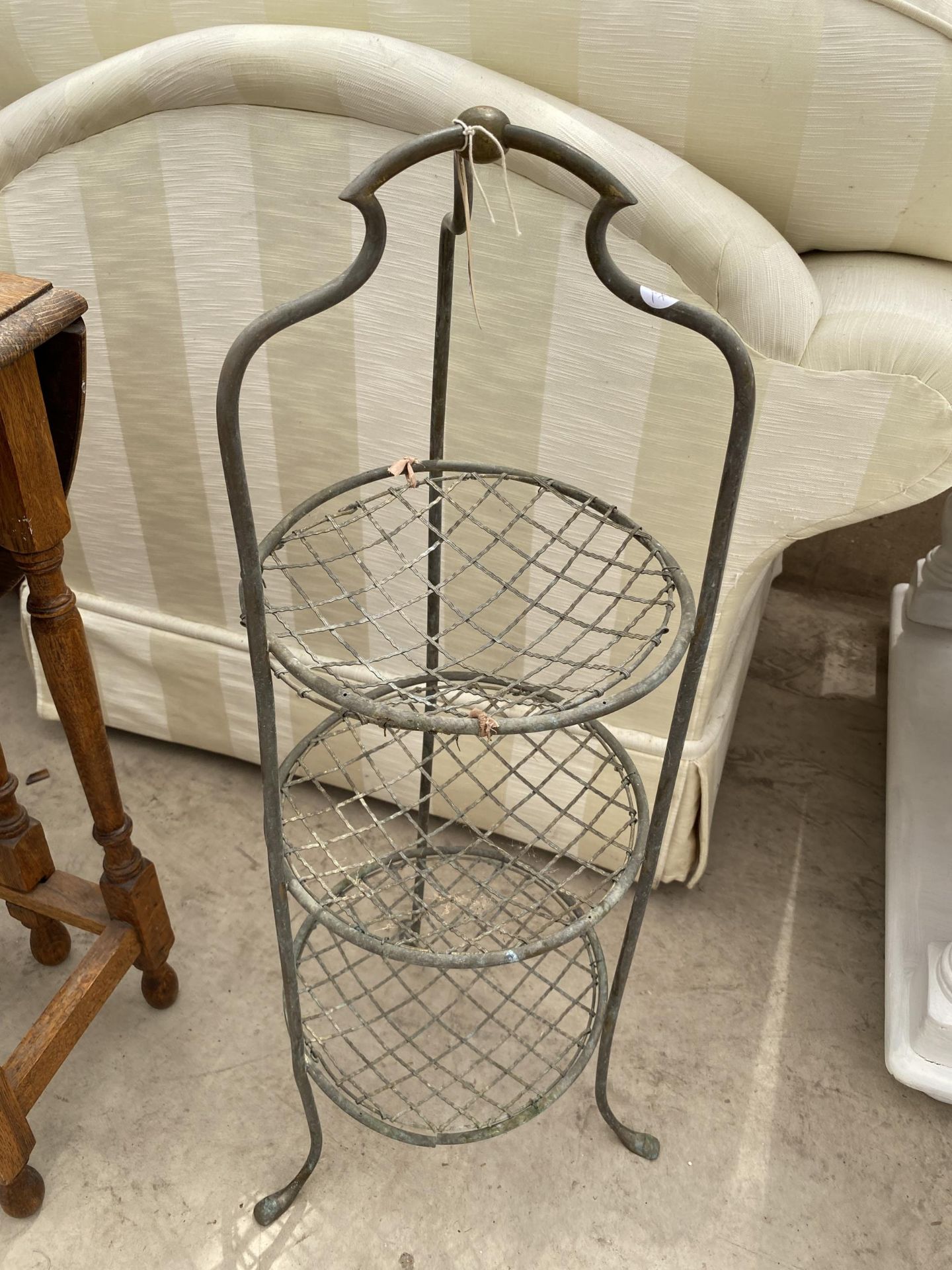 A VICTORIAN BRASS AND WIRE THREE TIER VEGATABLE RACK