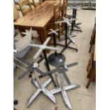 EIGHT VARIOUS METALWARE PUB TABLE BASES