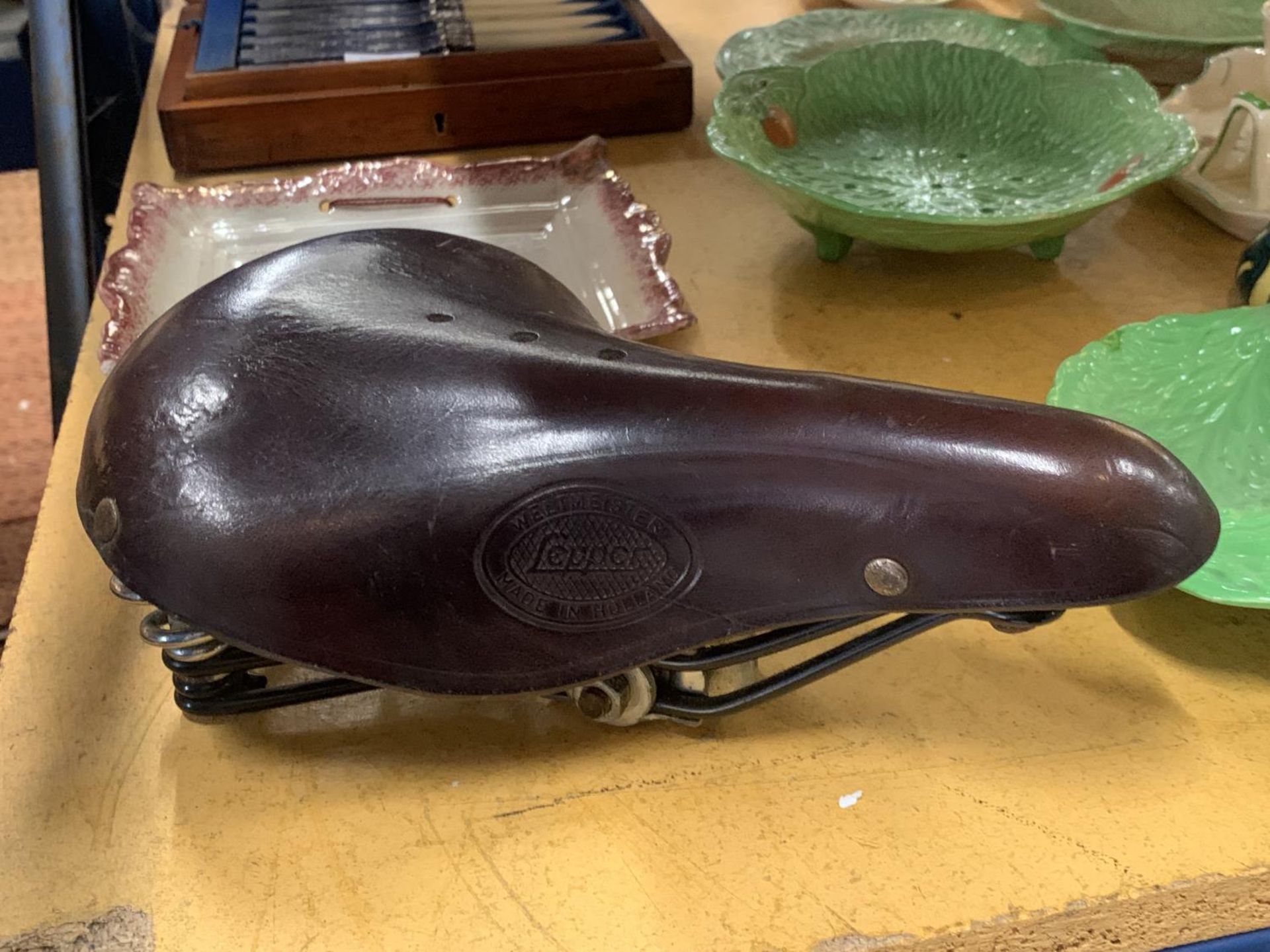 A VINTAGE BICYCLE SADDLE