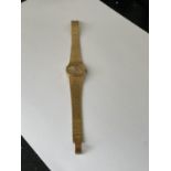 A TISSOT WRISTWATCH WITH YELLOW METAL STRAP SEEN WORKING BUT NO WARRANTY