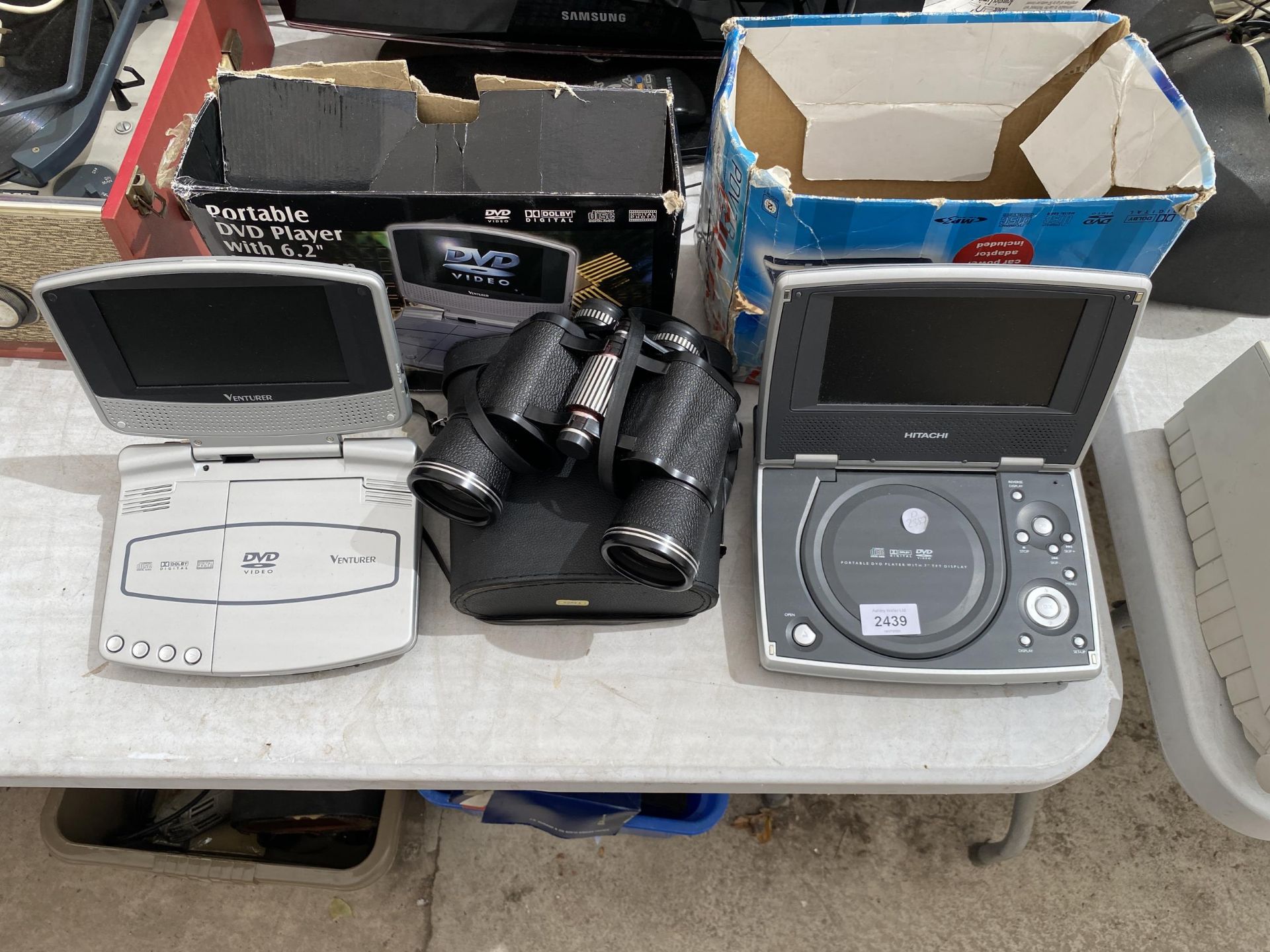 AN ASSORTMENT OF ITEMS TO INCLUDE PORTABLE DVD PLAYERS AND A PAIR OF BINOCULARS