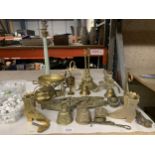 A QUANTITY OF BRASS TO INCLUDE BELLS, ORNAMENTS, BRACKETS, LAMP BASE, ETC.,