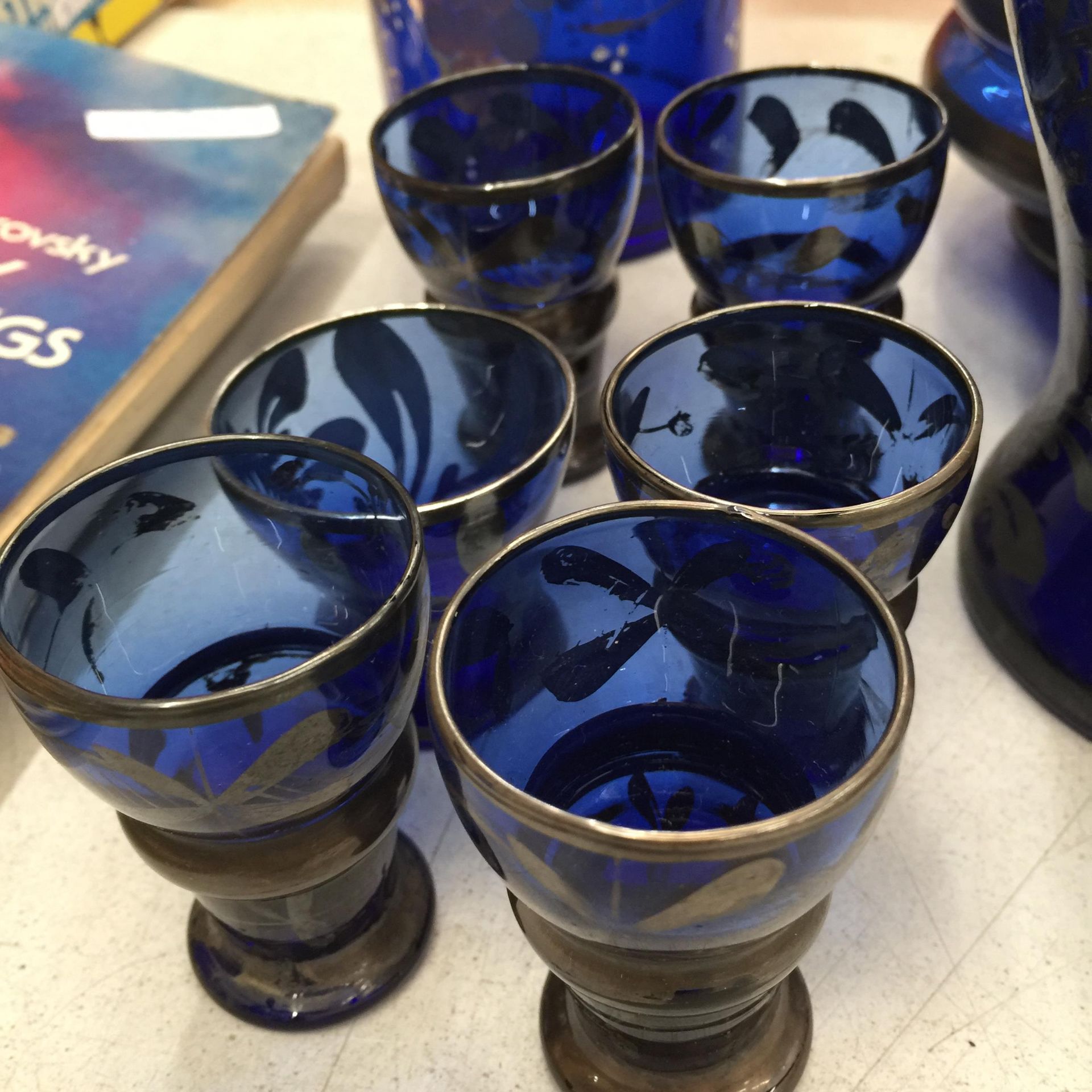 A VINTAGE BLUE GLASS WITH GILT DECORATION DECANTER, STORAGE JAR, VASE AND GLASSES PLUS FOUR - Image 3 of 4