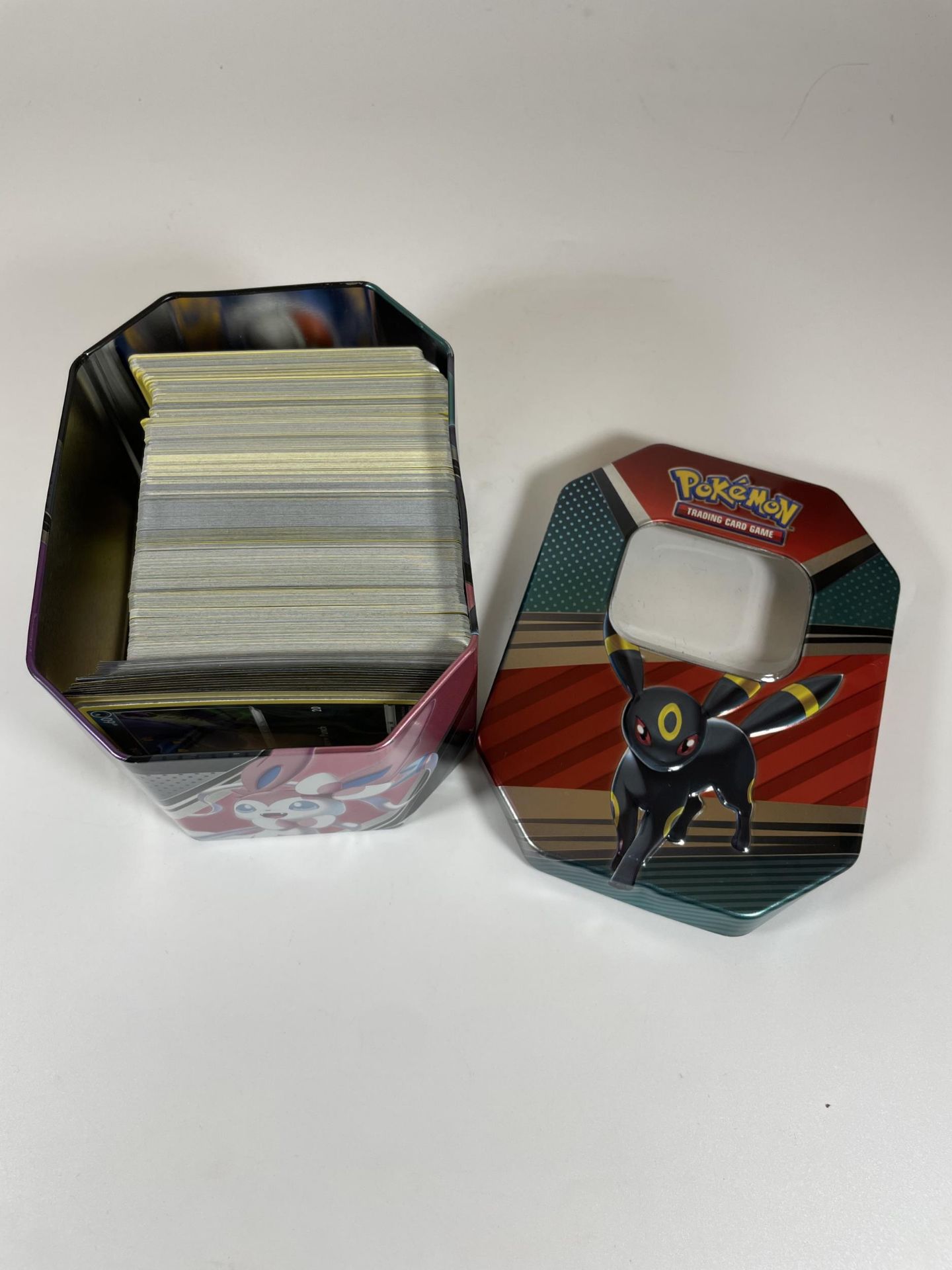 AN UMBREON TIN OF POKEMON TRADING CARDS, HOLOS ETC - Image 2 of 6
