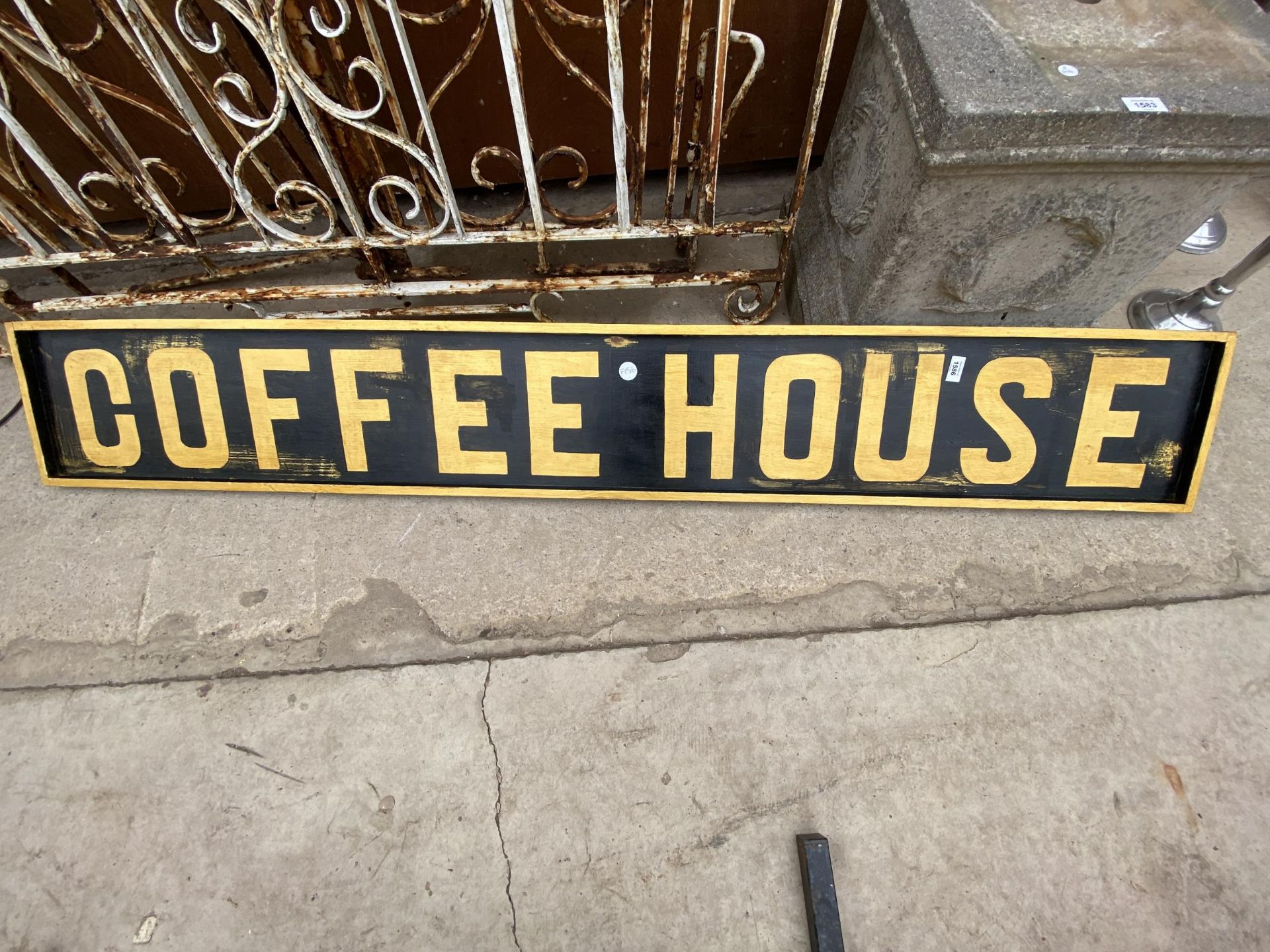 A WOODEN PAINTED 'COFFEE HOUSE' SIGN