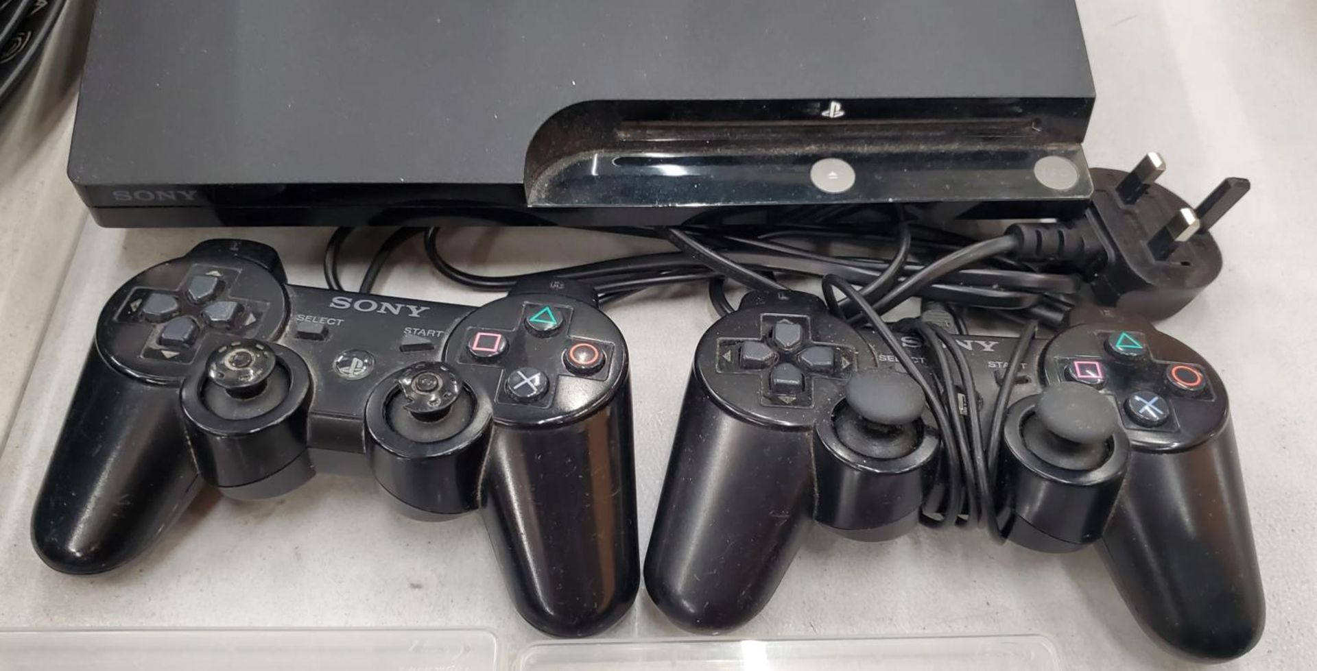 A PS3 GAMES CONSOLE WITH 2 CONTROLLERS AND SIX GAMES TO INCLUDE GRAN TURISMO 5 CALL OF DUTY, - Image 3 of 3