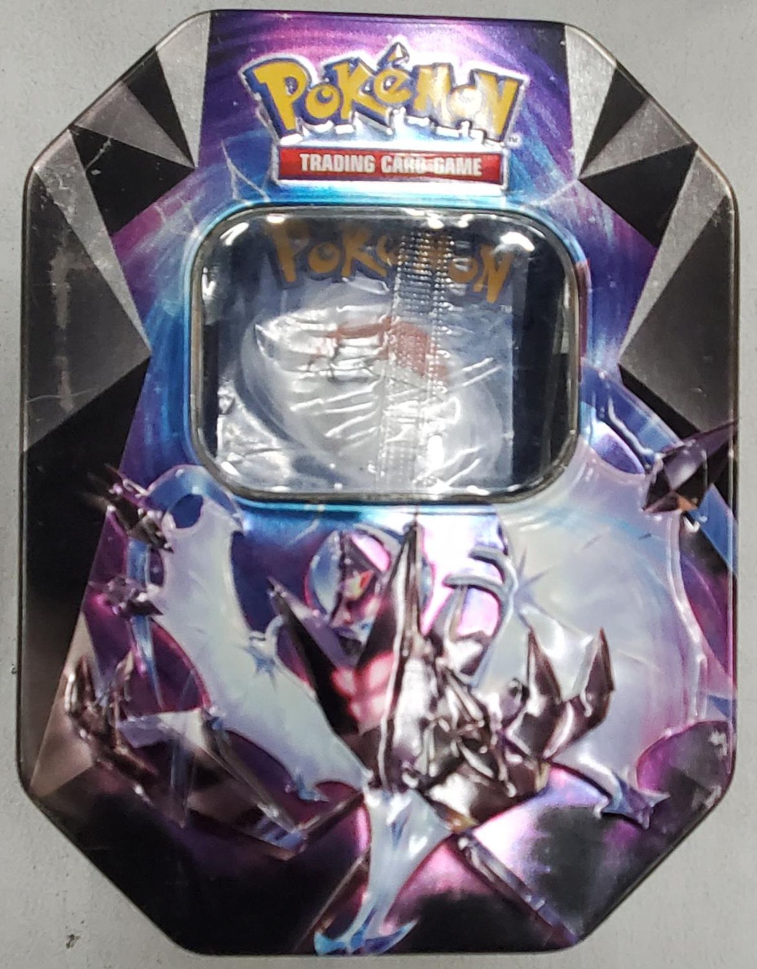 A COLLECTORS TIN OF POKEMON CARDS INCLUDING SHINIES, ETC