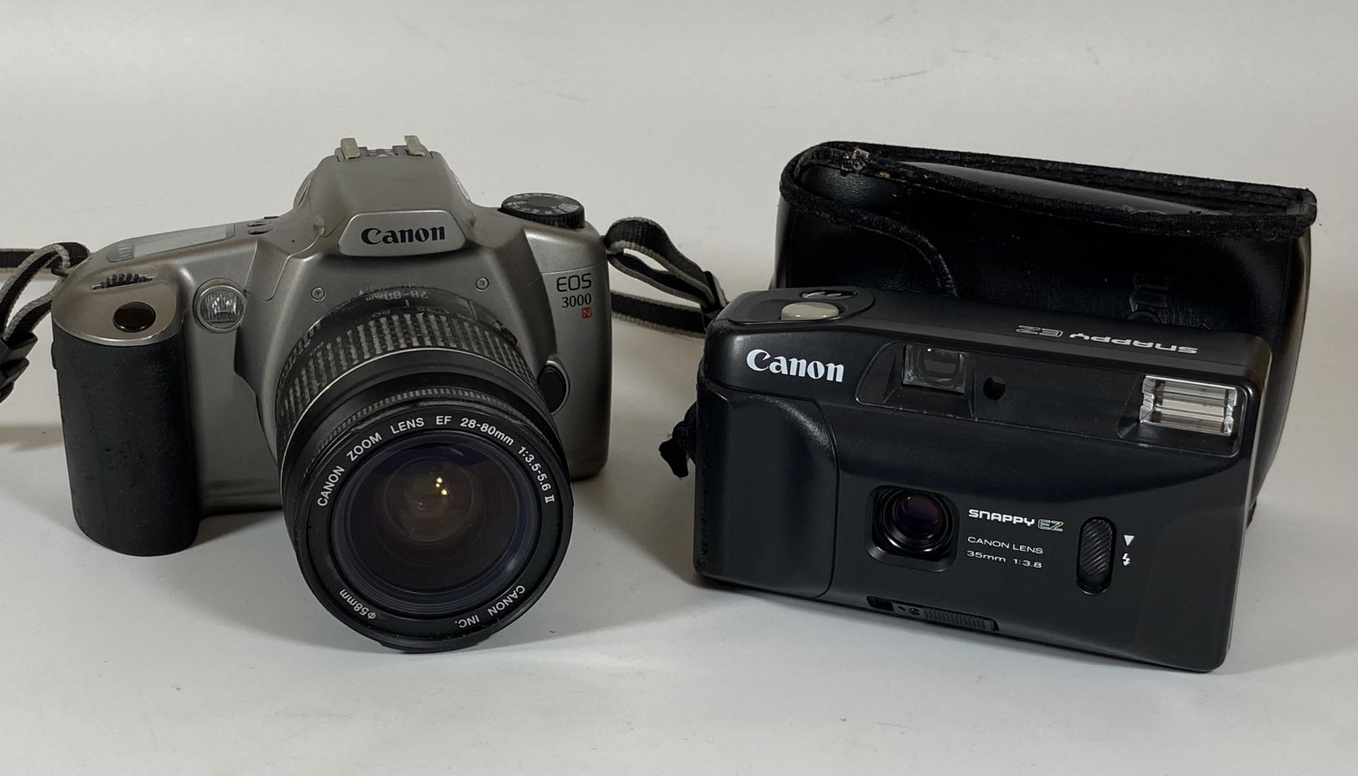 TWO CANON CAMERAS - CANON SNAPPY EZ WITH 35MM, CANON EOS 3000 N FITTED WITH CANON ZOOM LENS 28-80MM