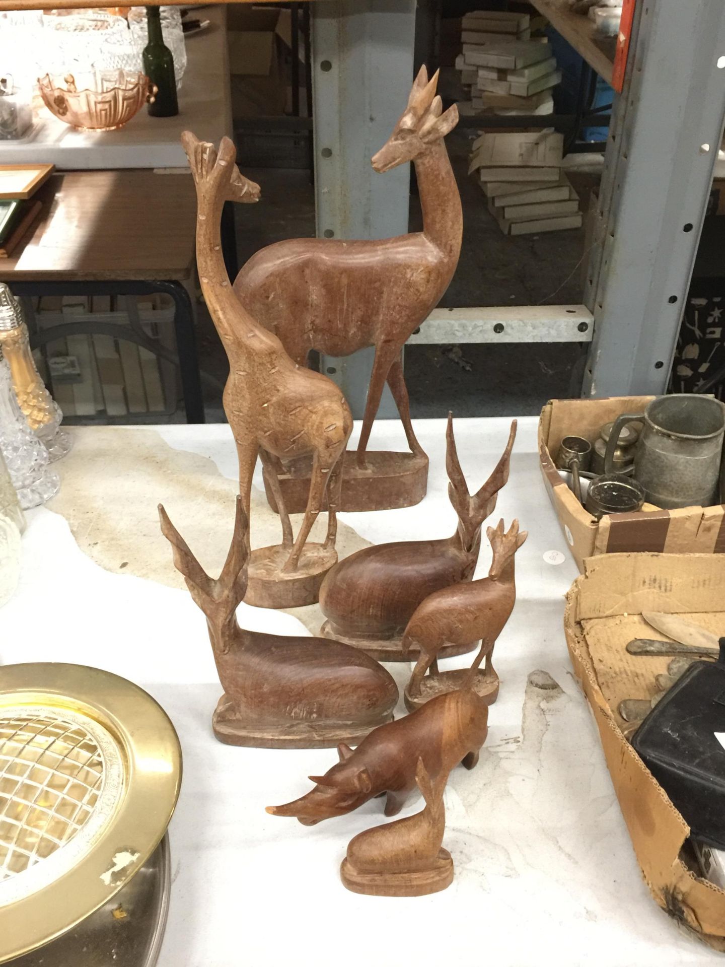 A COLLECTION OF WOODEN ANIMALS TO INCLUDE GIRAFFES, DEER AND A RHINOCEROUS - HORN A/F