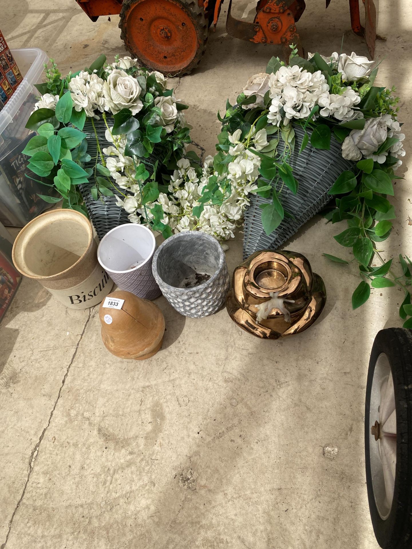 AN ASSORTMENT OF PLANTERS AND ARTIFICIAL FLOWERS