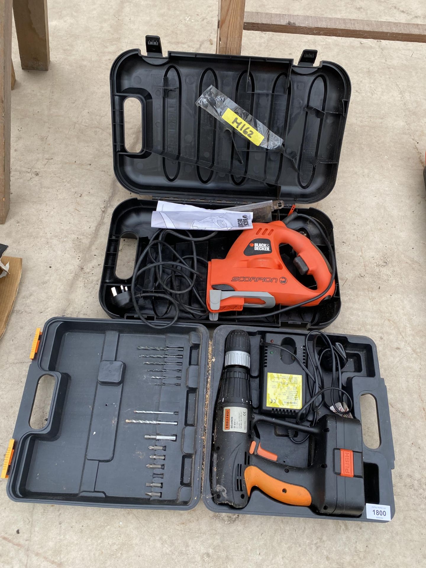 AN ELECTRIC BLACK AND DECKER SCORPION SAW AND A CHALLENGE BATTERY DRILL