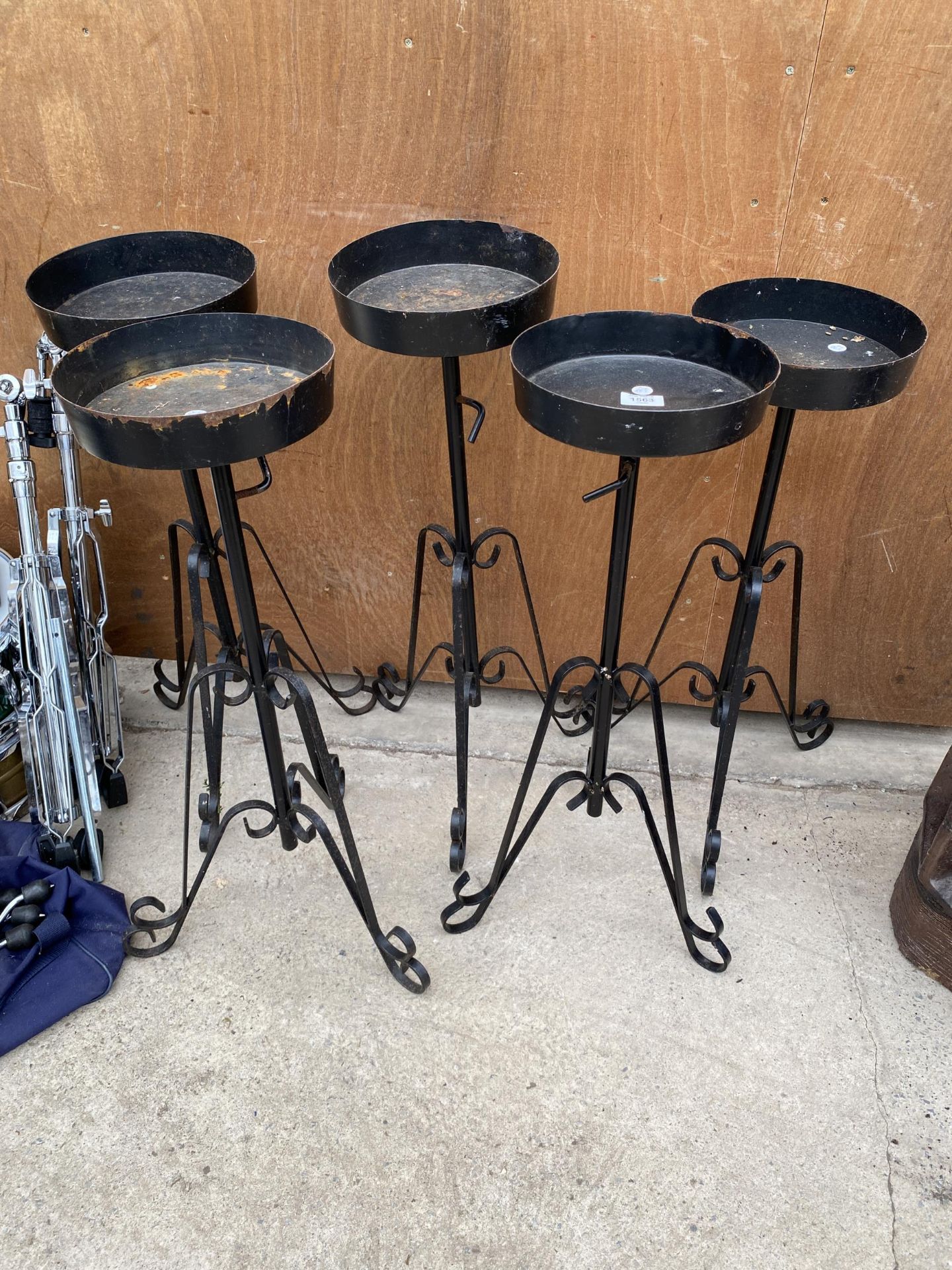 FIVE BLACK PAINTED METAL PLANT STANDS WITH TRIPOD BASE (H:74CM)