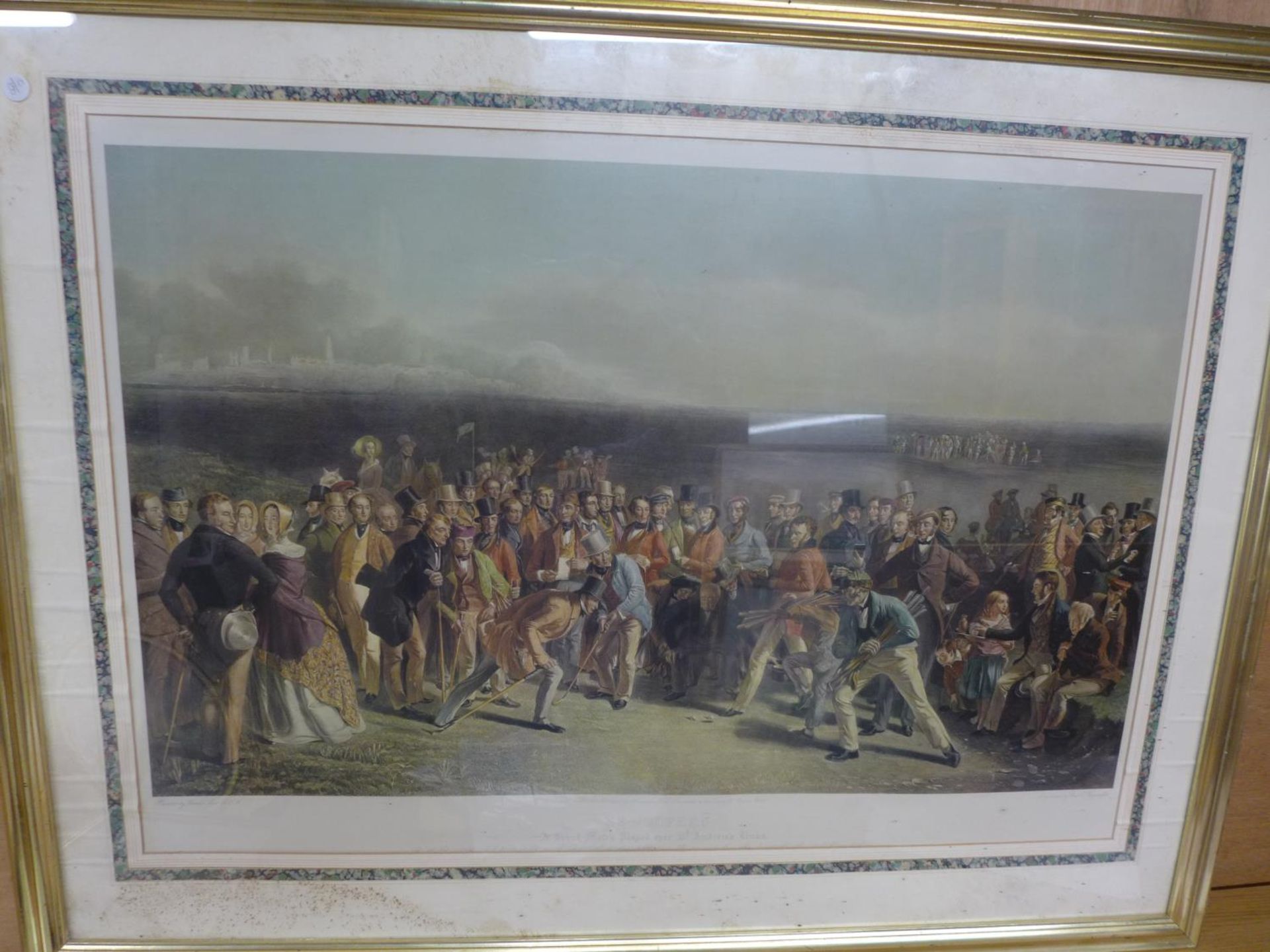 A COLOURED ENGRAVING 'THE GOLFERS A GRAND MATCH PLAYED OVER ST ANDREWS LINKS', ENGRAVED BY CHAS.E.
