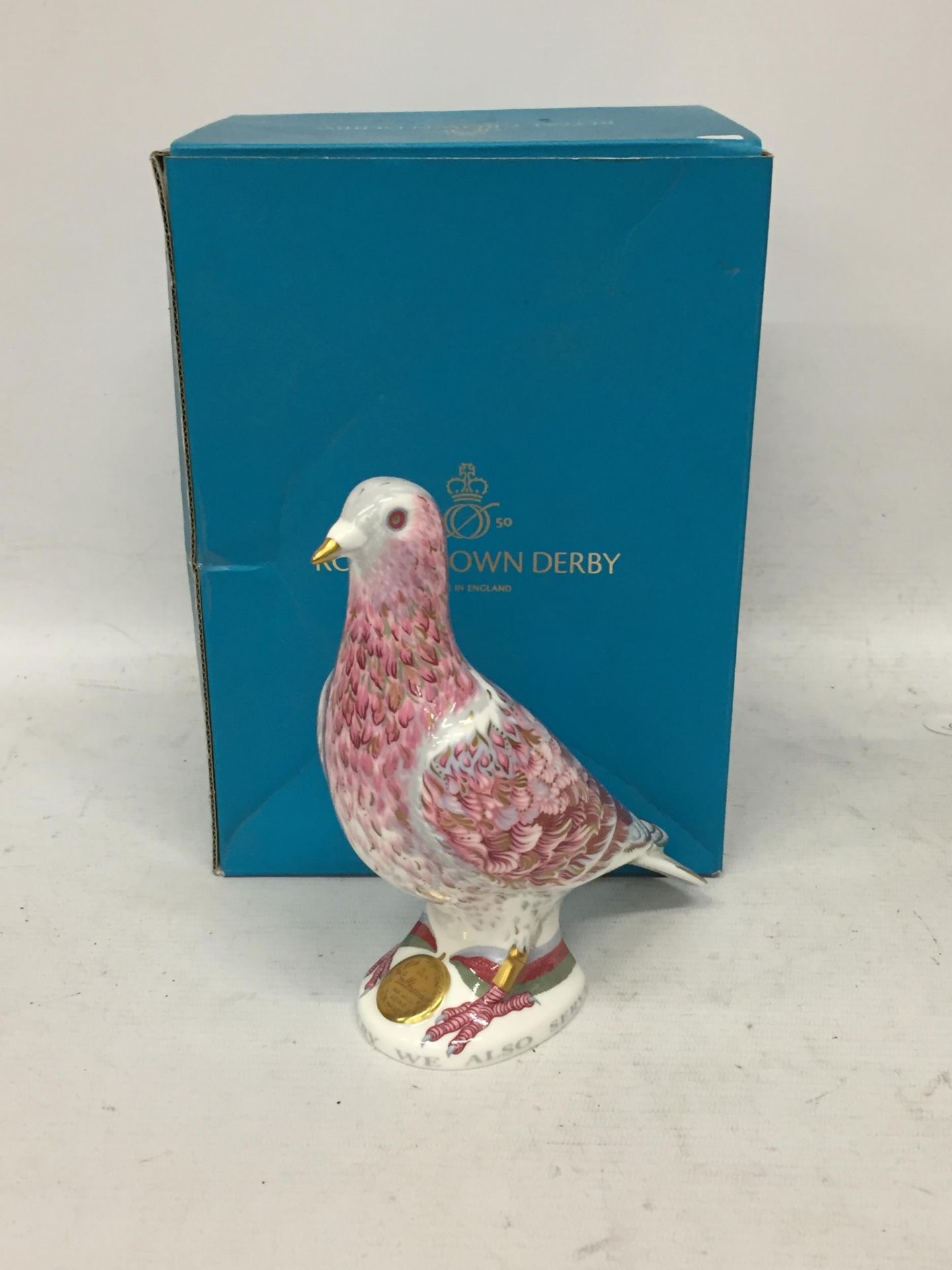 A ROYAL CROWN DERBY BOXED WAR PIGEON LIMITED EDITION PAPER WEIGHT