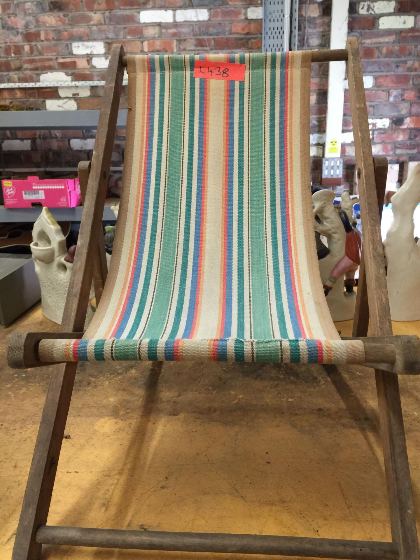 A VINTAGE CHILDREN'S DECKCHAIR WITH STRIPED FABRIC