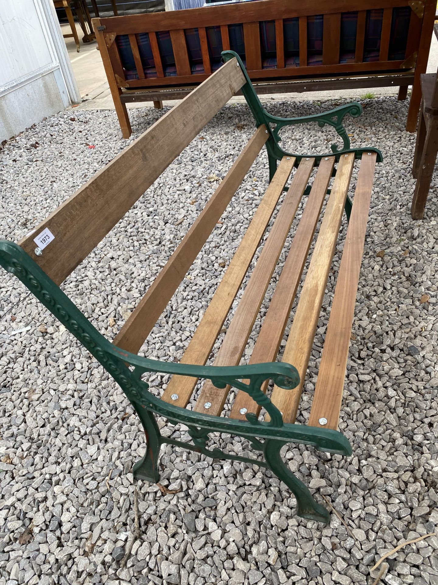 A WOODEN SLATTED GARDEN BENCH WITH CAST BENCH ENDS - Image 2 of 2