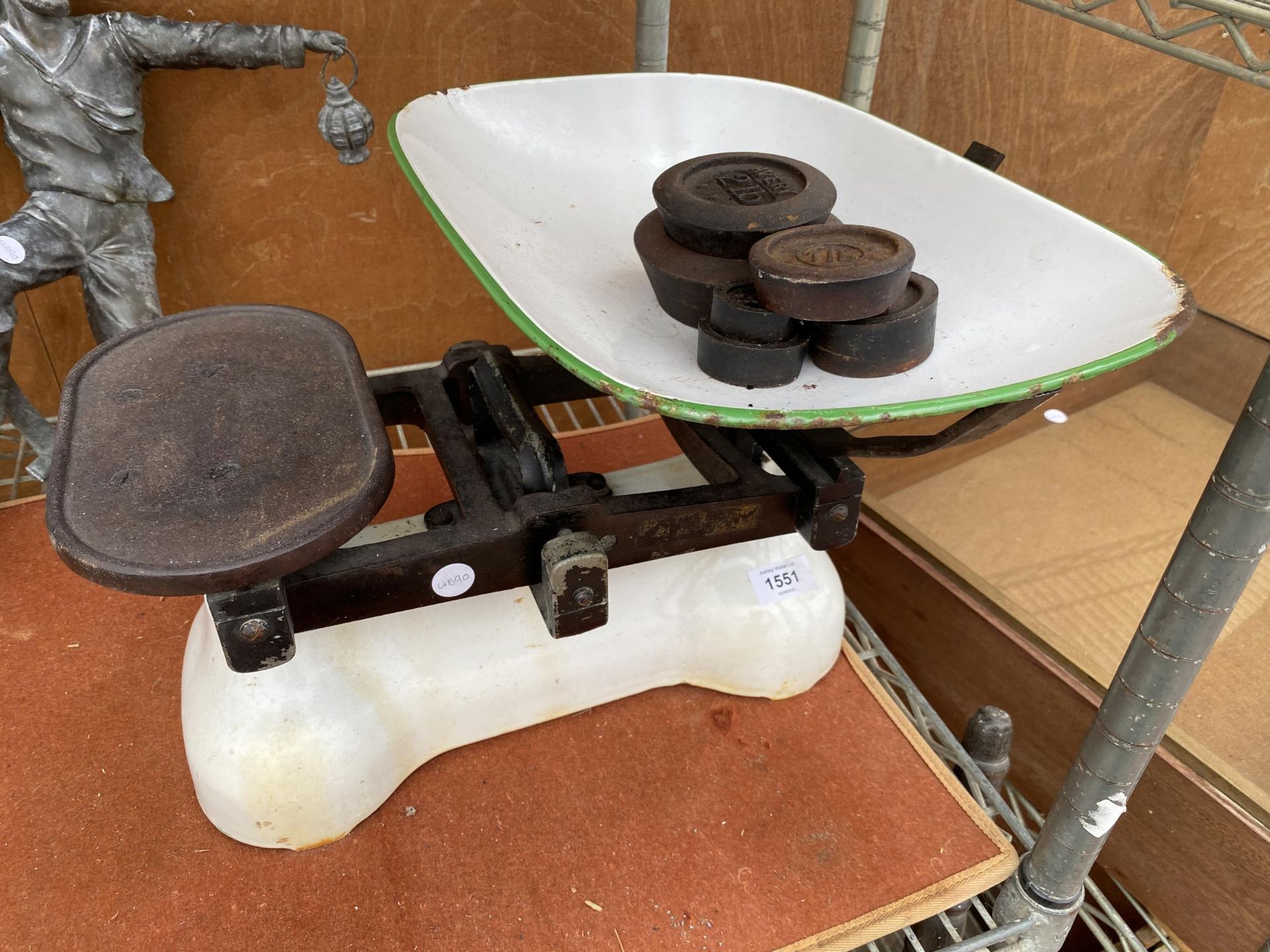 A SET OF VINTAGE BALANCE SCALES WITH AN ASSORTMENT OF CAST IRON WEIGHTS