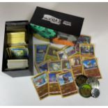 A TRAINER BOX OF ASSORTED POKEMON TRADING CARDS, HOLOS, TOKENS ETC