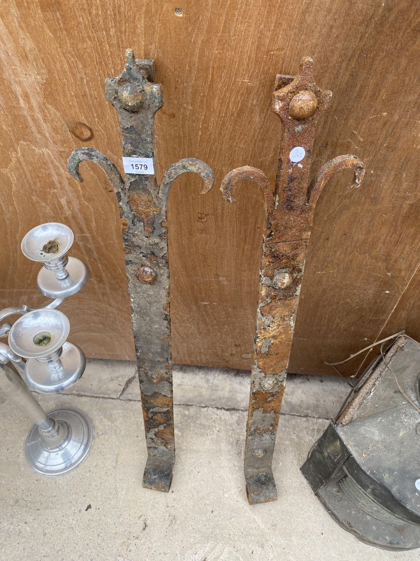 A PAIR OF HEAVY AND DECORATIVE WROUGHT IRON GATE HINGES