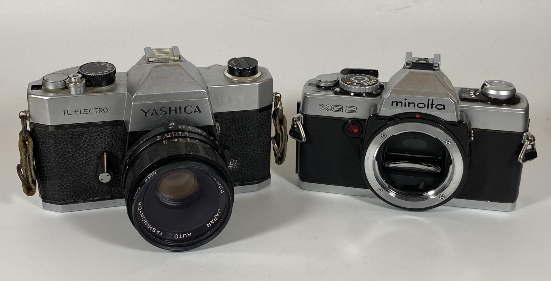 TWO VINTAGE CAMERAS - YASHICA TL-ELECTRO FITTED WITH A YASHICA AUTO 50MM LENS AND A MINOLTA XG2 BODY