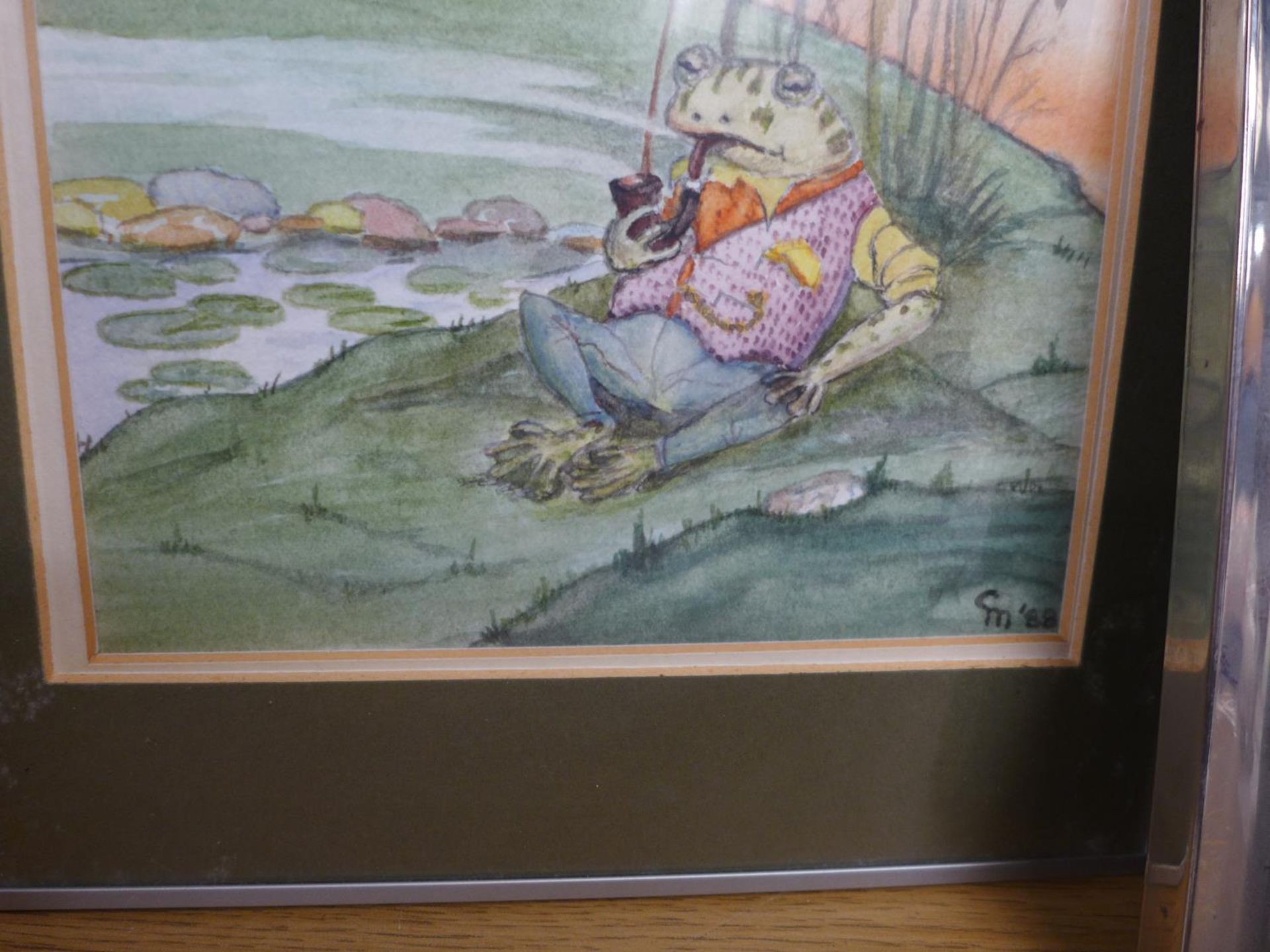 G.N (BRITISH 20TH CENTURY) 'TOAD FROM WIND IN THE WILLOWS' BY A POND WATERCOLOUR, INITIALS 88, - Image 2 of 3