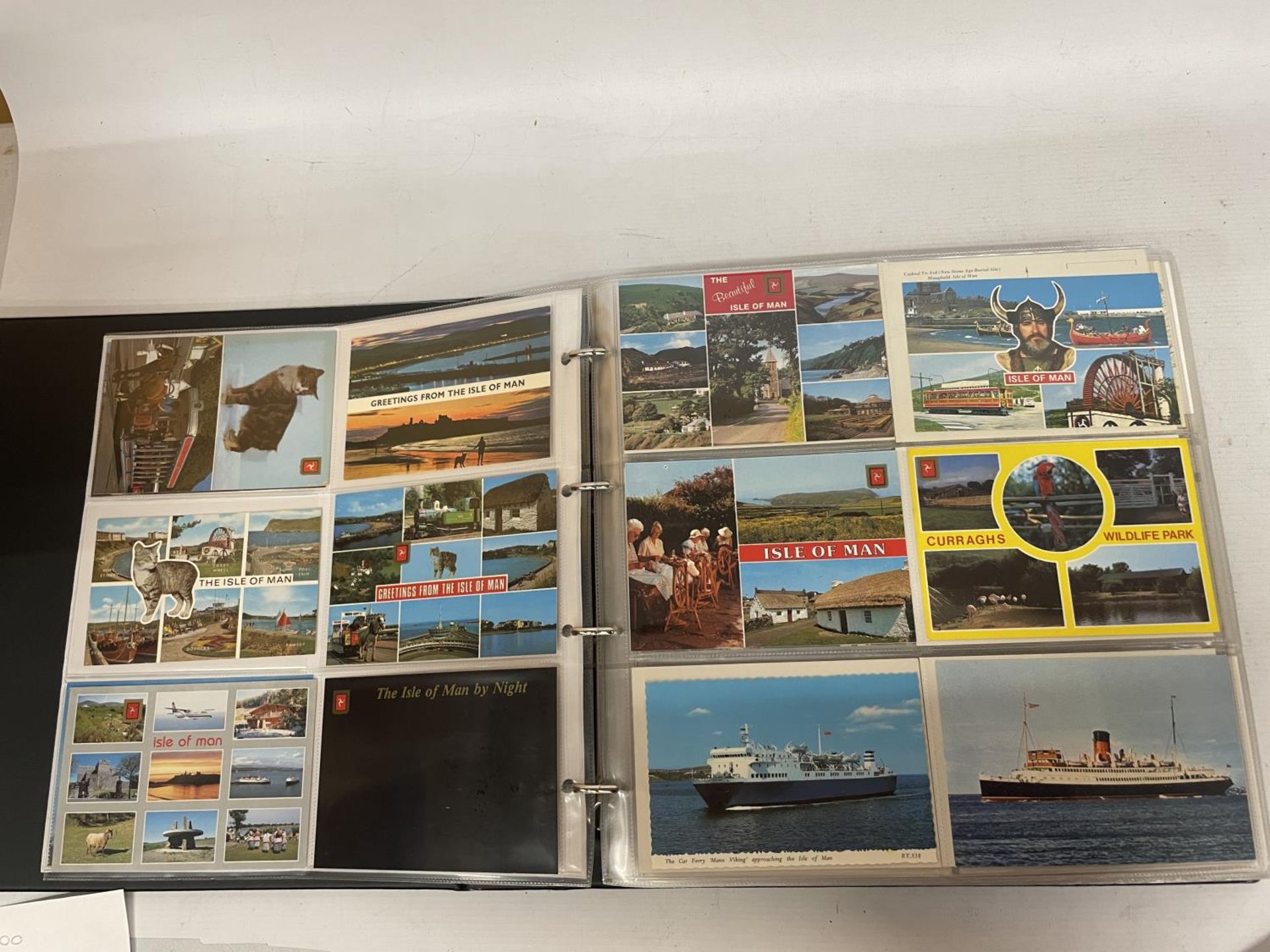 APPROXIMATELY 435 POSTCARDS RELATING TO THE ISLE OF MAN, WALES AND IRELAND IN A FOLDER
