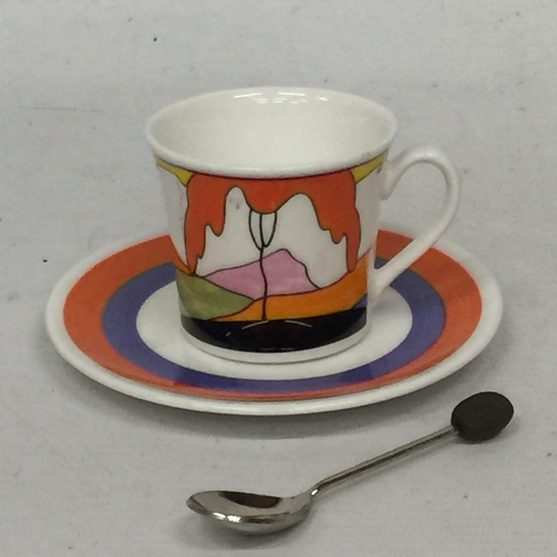 A WEDGEWOOD CLARICE CLIFF LIMITED EDITION CUP, SAUCER AND SPOON