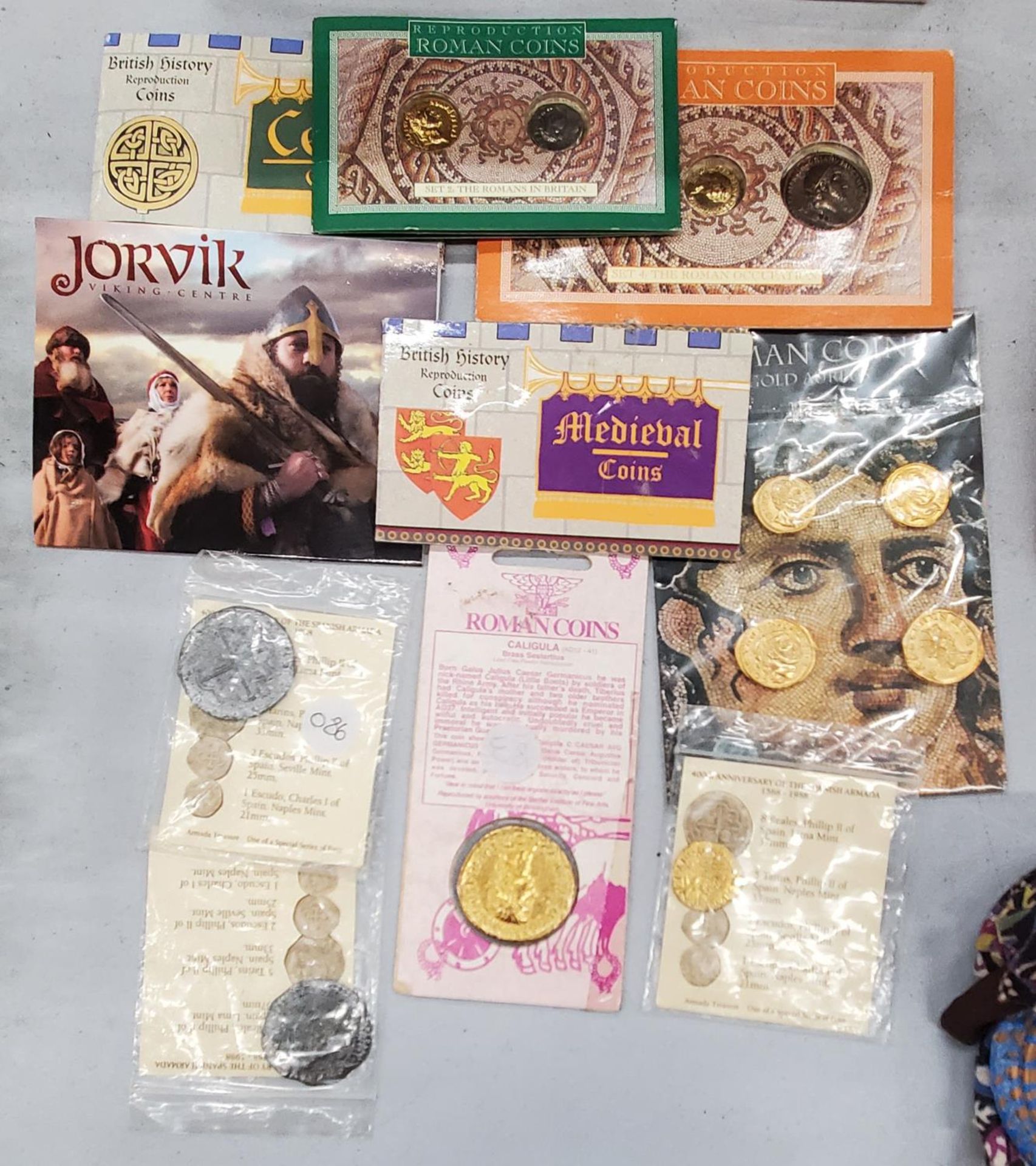 A COLLECTION OF REPRODUCTION HISTORIC COIN SETS TO INCLUDE CELTIC, ROMAN, VIKING, MEDIEVAL, ETC