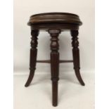 A VICTORIAN WOODEN ADJUSTABLE PIANO STOOL