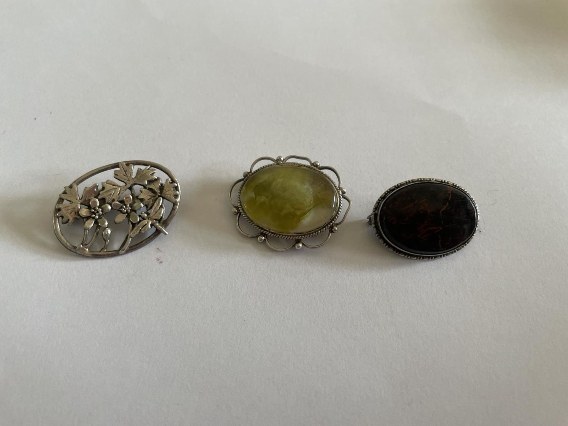 THREE SILVER BROOCHES